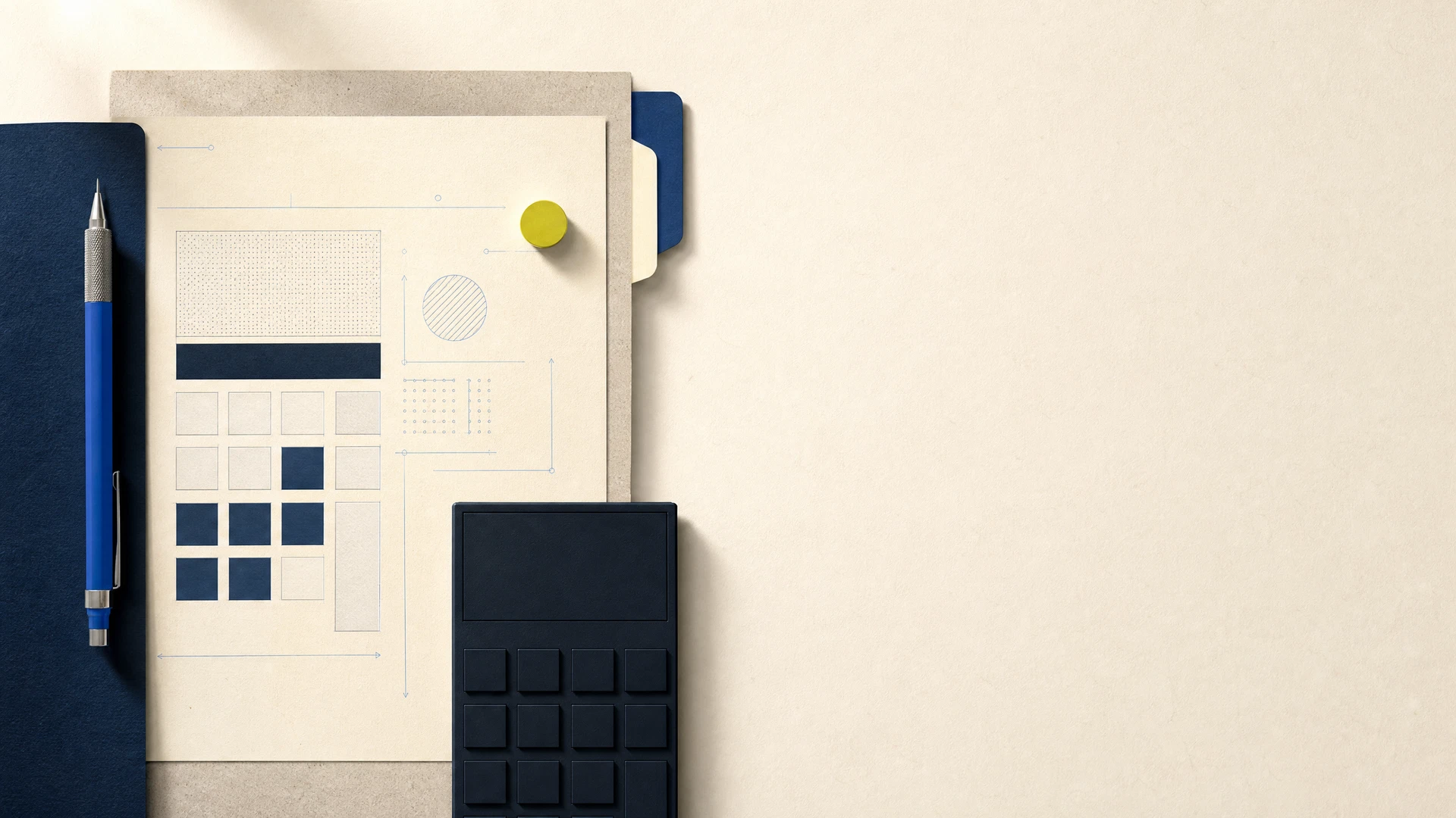 A thoughtfully arranged paper workspace with blue stationery and a chartreuse marker